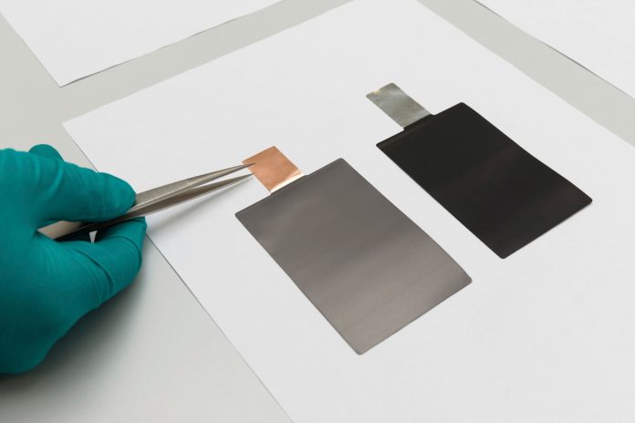 Individual-electrode-sheets-being-inserted-into-a-pouch-cell